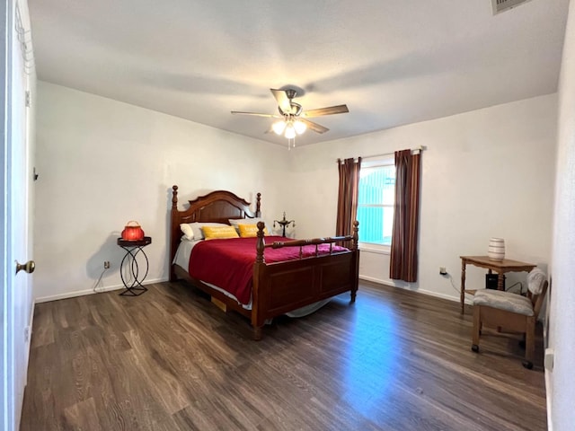 bedroom featuring dark hardwood / wood-style floors and ceiling fan