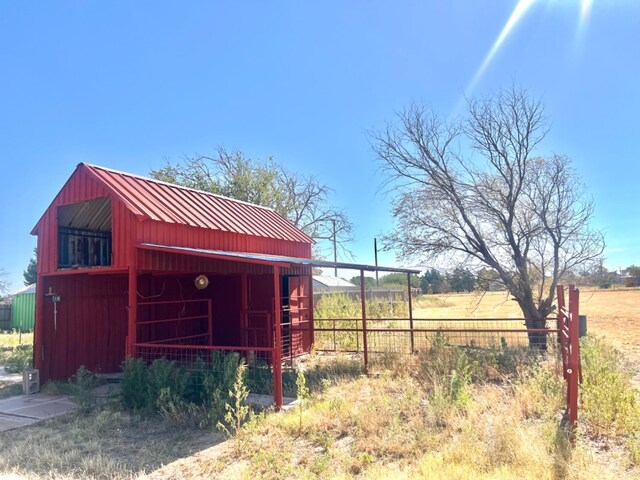 view of outbuilding featuring a rural view