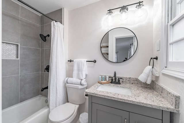 full bathroom with vanity, toilet, and shower / bathtub combination with curtain