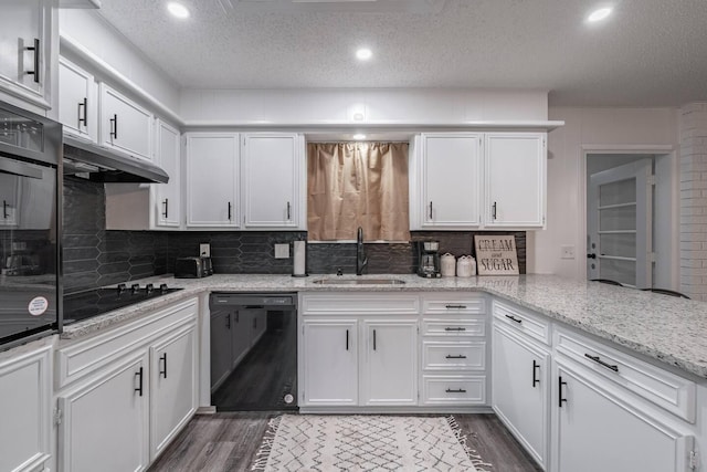 kitchen with white cabinetry, sink, and black appliances