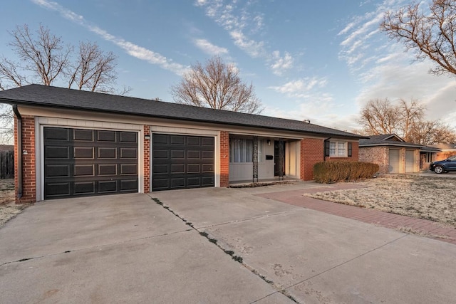 ranch-style home featuring a garage