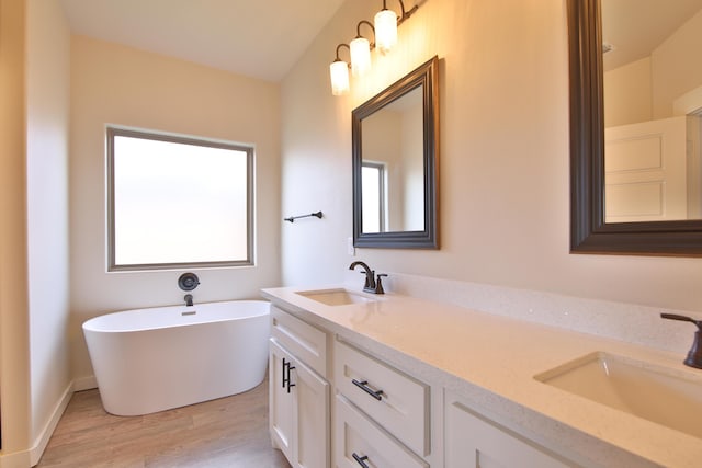 10504 Ave X, Lubbock, TX 79423 - full bath with double vanity, wood finished floors, and a soaking tub