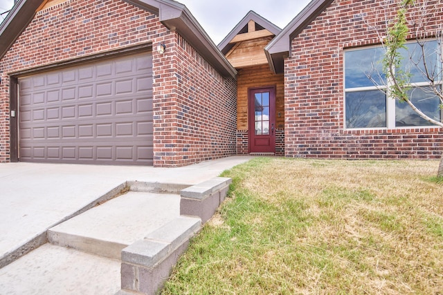 10504 Ave X, Lubbock, TX 79423 - property entrance featuring brick siding, concrete driveway, a garage, and a lawn