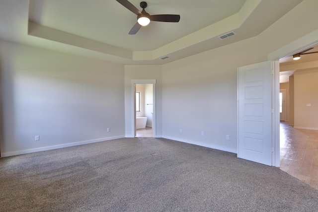 10504 Ave X, Lubbock, TX 79423 - unfurnished room with a ceiling fan, carpet floors, and a raised ceiling