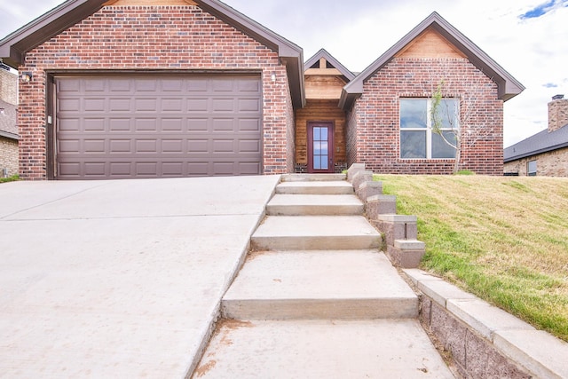 10504 Ave X, Lubbock, TX 79423 - ranch-style house featuring brick siding, driveway, a front lawn, and an attached garage