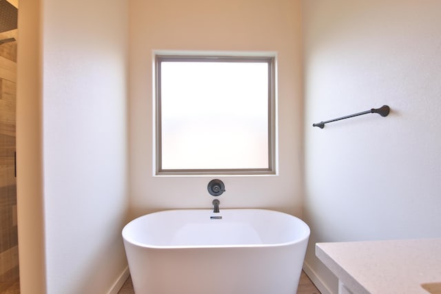 10504 Ave X, Lubbock, TX 79423 - bathroom featuring a soaking tub and vanity