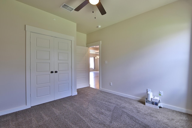 10504 Ave X, Lubbock, TX 79423 - unfurnished bedroom featuring dark carpet, a closet, and a ceiling fan