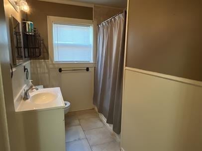 bathroom with tile patterned floors, vanity, toilet, and a shower with shower curtain