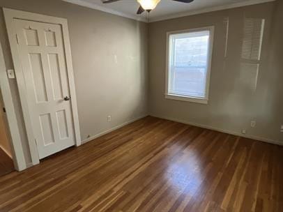 unfurnished room featuring ornamental molding, dark hardwood / wood-style floors, and ceiling fan