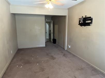 spare room featuring ornamental molding and ceiling fan