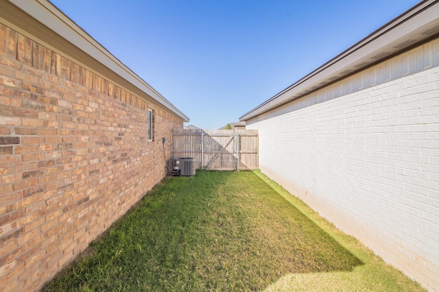 view of yard with central air condition unit