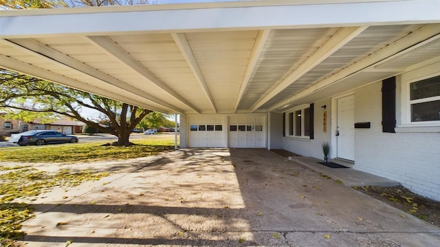 exterior space featuring a carport and a garage