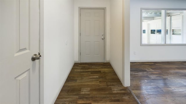 corridor featuring dark hardwood / wood-style floors