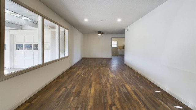 empty room featuring dark hardwood / wood-style floors and ceiling fan