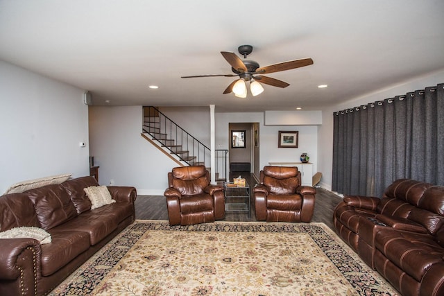 living room with hardwood / wood-style flooring and ceiling fan