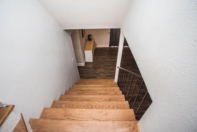 stairway featuring hardwood / wood-style floors