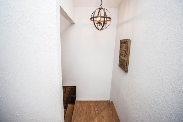 interior space featuring wood-type flooring and a chandelier