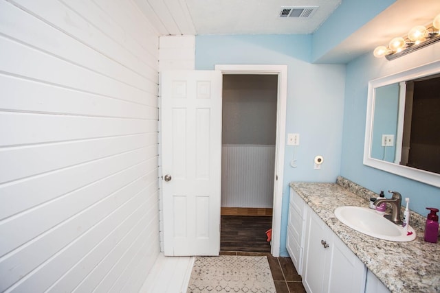 bathroom with tile patterned flooring and vanity