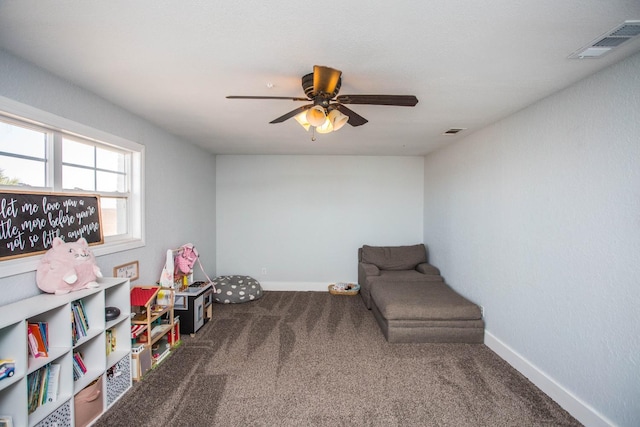 recreation room featuring carpet and ceiling fan