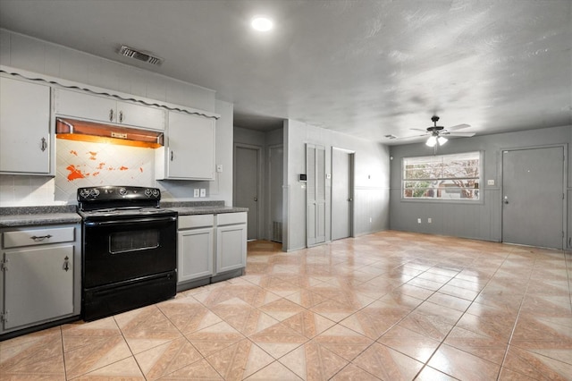 kitchen with tasteful backsplash, black range with electric cooktop, and ceiling fan