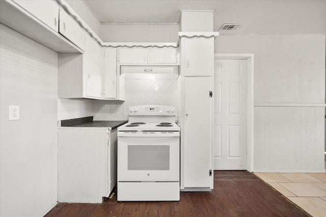 kitchen featuring white cabinetry, dark hardwood / wood-style floors, decorative backsplash, and electric range