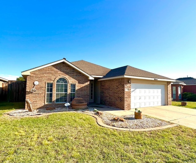 single story home featuring a garage and a front yard