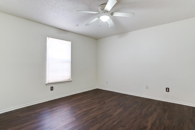 spare room with dark wood-type flooring, ceiling fan, and a textured ceiling