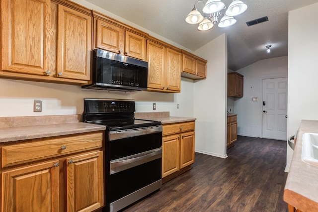 kitchen featuring lofted ceiling, an inviting chandelier, hanging light fixtures, double oven range, and dark hardwood / wood-style flooring