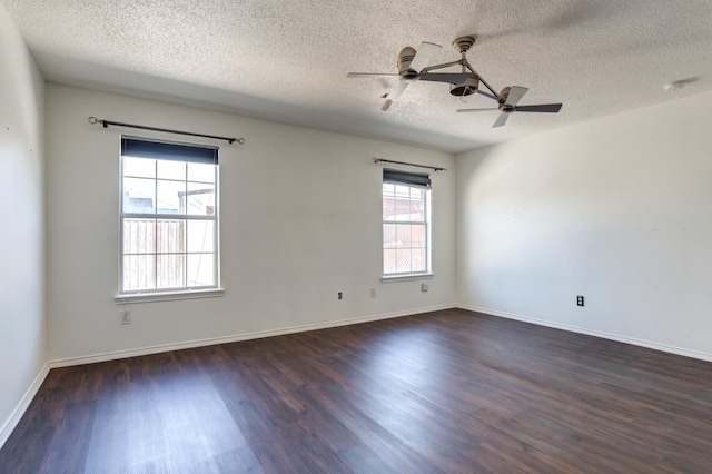 spare room with ceiling fan, dark hardwood / wood-style flooring, and a textured ceiling