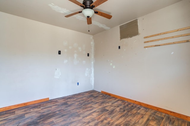 unfurnished room with dark hardwood / wood-style flooring and ceiling fan