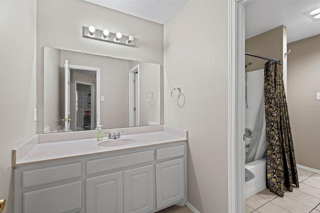 bathroom featuring tile patterned floors, shower / bathtub combination with curtain, a textured ceiling, and vanity