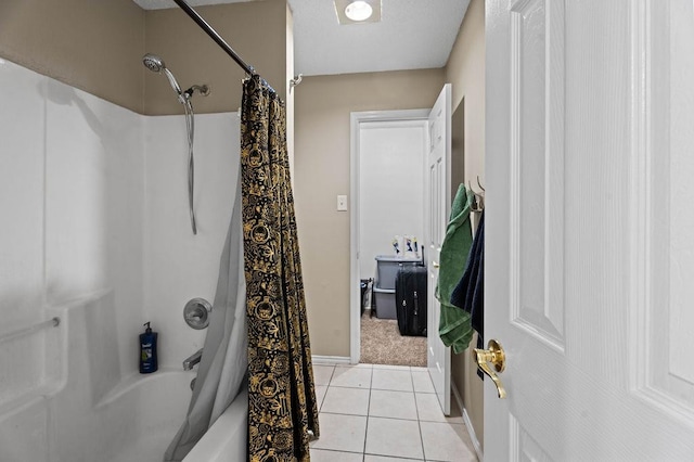 bathroom featuring tile patterned flooring and shower / bath combo