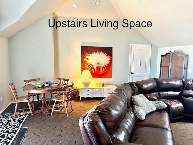 living room featuring vaulted ceiling and carpet flooring