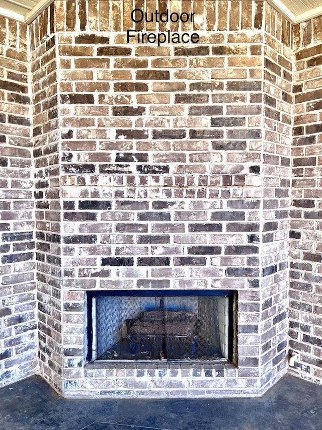 details featuring a brick fireplace