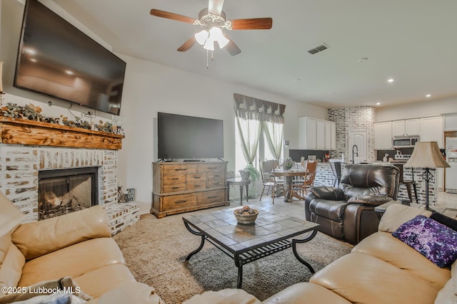 14320 Ave U, Lubbock, TX 79423 - living area featuring a brick fireplace, ceiling fan, and recessed lighting