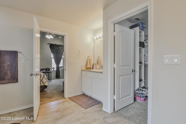 14320 Ave U, Lubbock, TX 79423 - hallway with a sink and baseboards