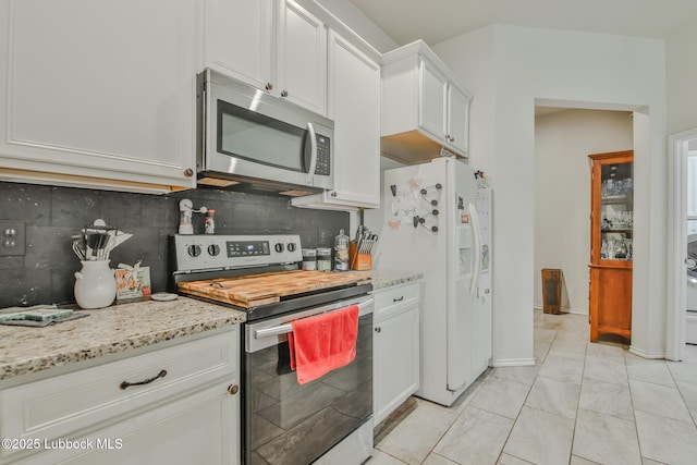 14320 Ave U, Lubbock, TX 79423 - kitchen with appliances with stainless steel finishes, backsplash, white cabinets, and light stone countertops