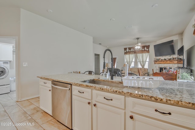 14320 Ave U, Lubbock, TX 79423 - kitchen with dishwasher, ceiling fan, light stone counters, and washer / clothes dryer