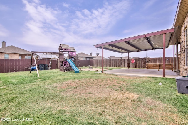 14320 Ave U, Lubbock, TX 79423 - fenced backyard with a playground, a patio area, and a trampoline