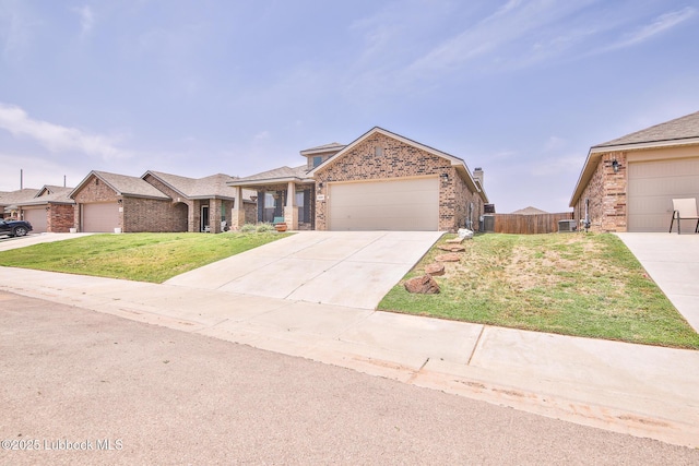 14320 Ave U, Lubbock, TX 79423 - view of front of home featuring brick siding, a garage, and concrete driveway