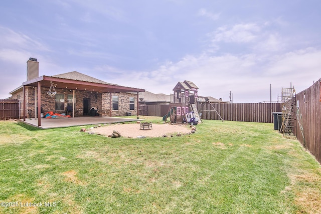 14320 Ave U, Lubbock, TX 79423 - fenced backyard featuring a playground, a patio area, and a fire pit