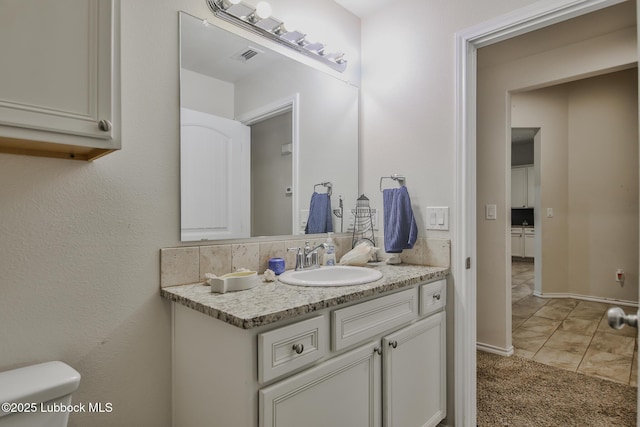 14320 Ave U, Lubbock, TX 79423 - bathroom with vanity and toilet