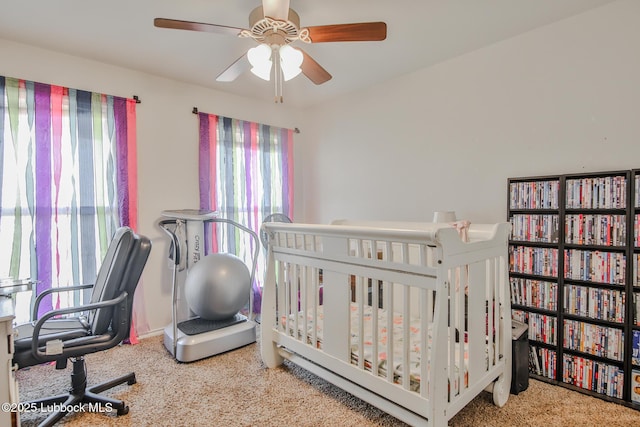 14320 Ave U, Lubbock, TX 79423 - bedroom featuring carpet floors, a ceiling fan, and a nursery area