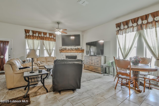 14320 Ave U, Lubbock, TX 79423 - living area featuring a ceiling fan and a fireplace