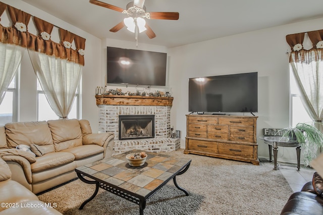 14320 Ave U, Lubbock, TX 79423 - living room featuring ceiling fan, healthy amount of natural light, a fireplace, and tile patterned floors