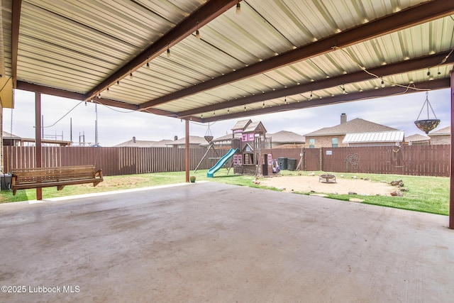 14320 Ave U, Lubbock, TX 79423 - fenced backyard featuring a playground and a patio