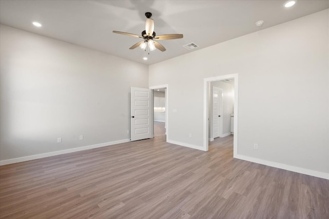 unfurnished bedroom with ceiling fan and light hardwood / wood-style floors