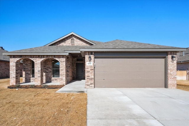 view of front facade with a garage and a front yard