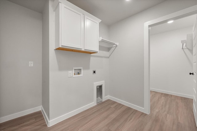 clothes washing area featuring hookup for a washing machine, cabinets, hookup for an electric dryer, and light wood-type flooring