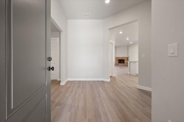 hallway with light wood-type flooring